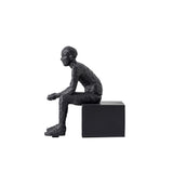 Serre livre statue homme assis