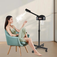 Appareil de soin du visage à vapeur sur pied 800 W noir pour salons de beauté et spas, avec roulettes pivotantes à 360°